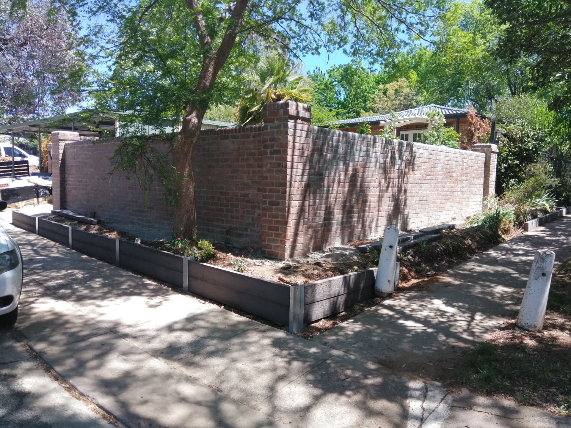 Red face brick boundary wall with brick piers built in Cessnock