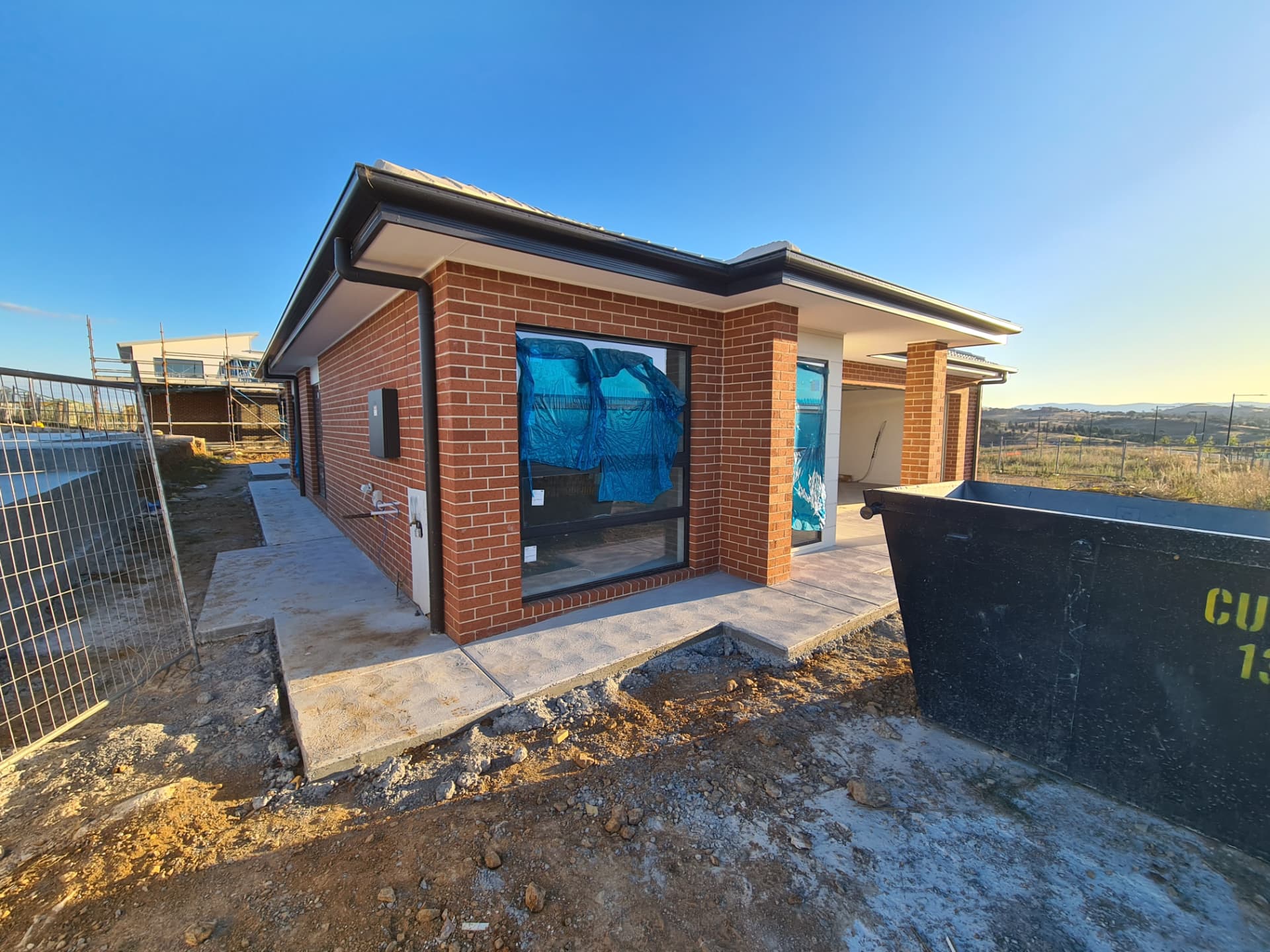 Red face brick single storey new home with brick piers and alfresco